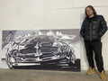 BROOK standing beside the large Formula 400 automotive artwork